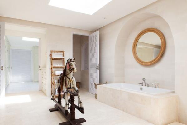 Large Bathroom With Bathtub And Horse Wooden Statue
