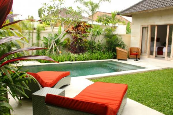 Pool Area With 2 Sun Loungers & 2 Chair In Front Of The Bedroom