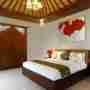 Spacious Bedroom Double Bed And Red Flower Painting
