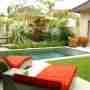 Pool Area With 2 Sun Loungers & 2 Chair In Front Of The Bedroom
